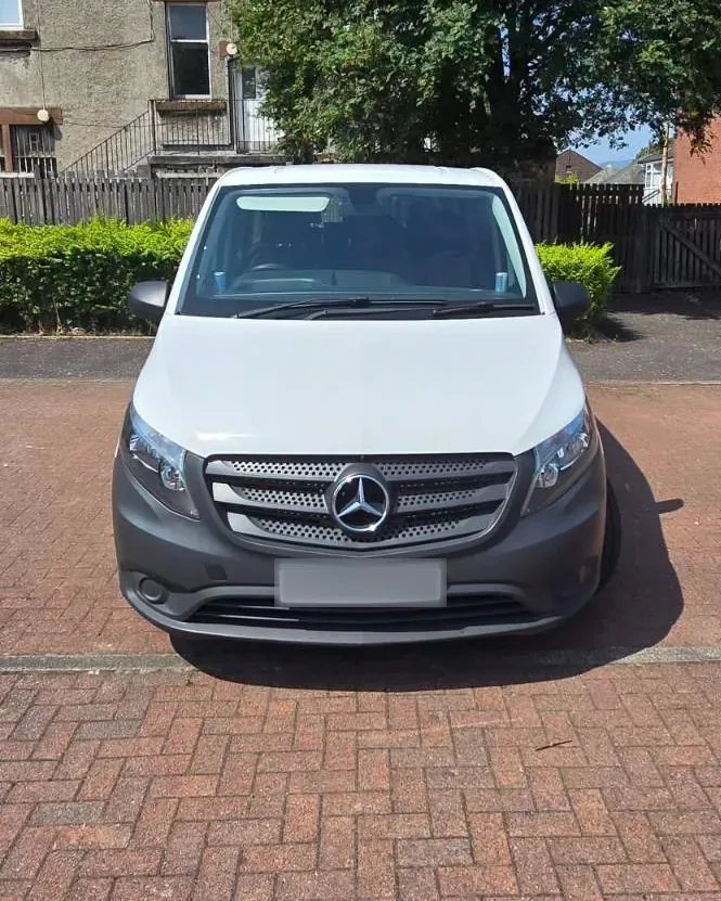 Front view of the white 8-seater Mercedes Vito van for group airport transfers in Glasgow